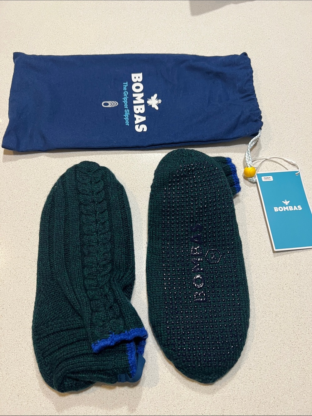 Bombas Women’s Gripper Slippers.  Forest Green, blue trim.   Size Medium. NWT